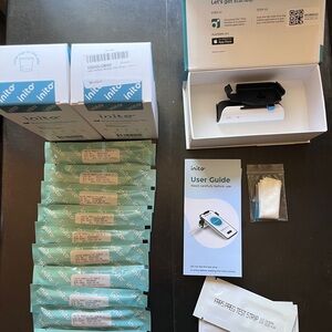 Inito Monitor (used). Unopened Test Strips (new).